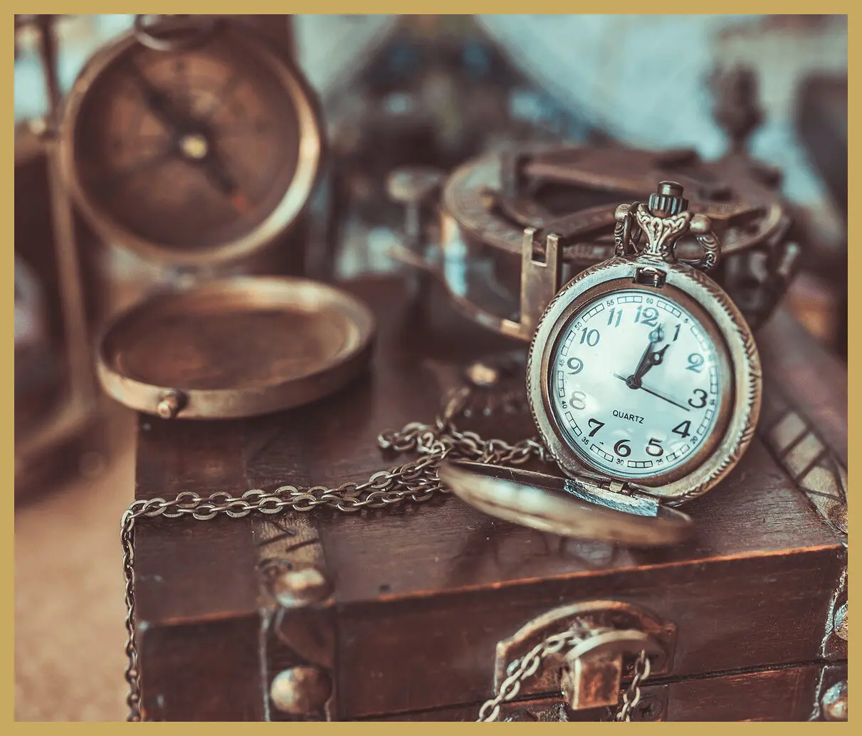 Vintage pocket watch on wooden box.