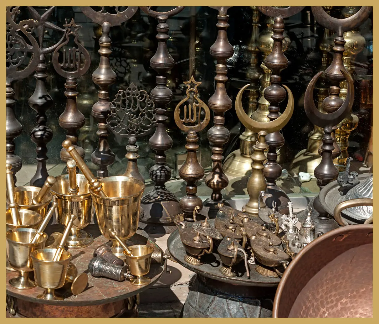 Brass and bronze ornaments displayed in shop.