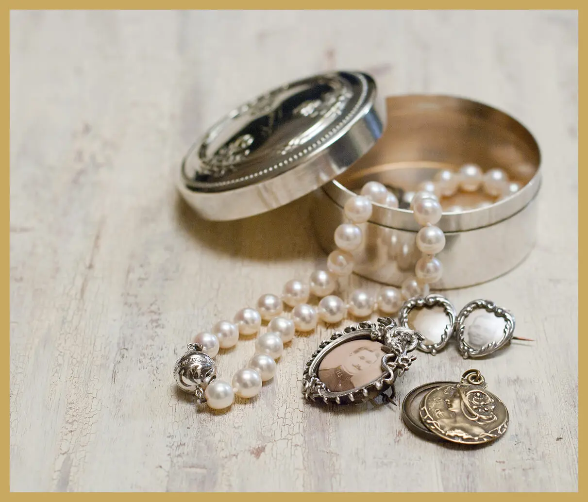 Pearl necklace and jewelry with open box.