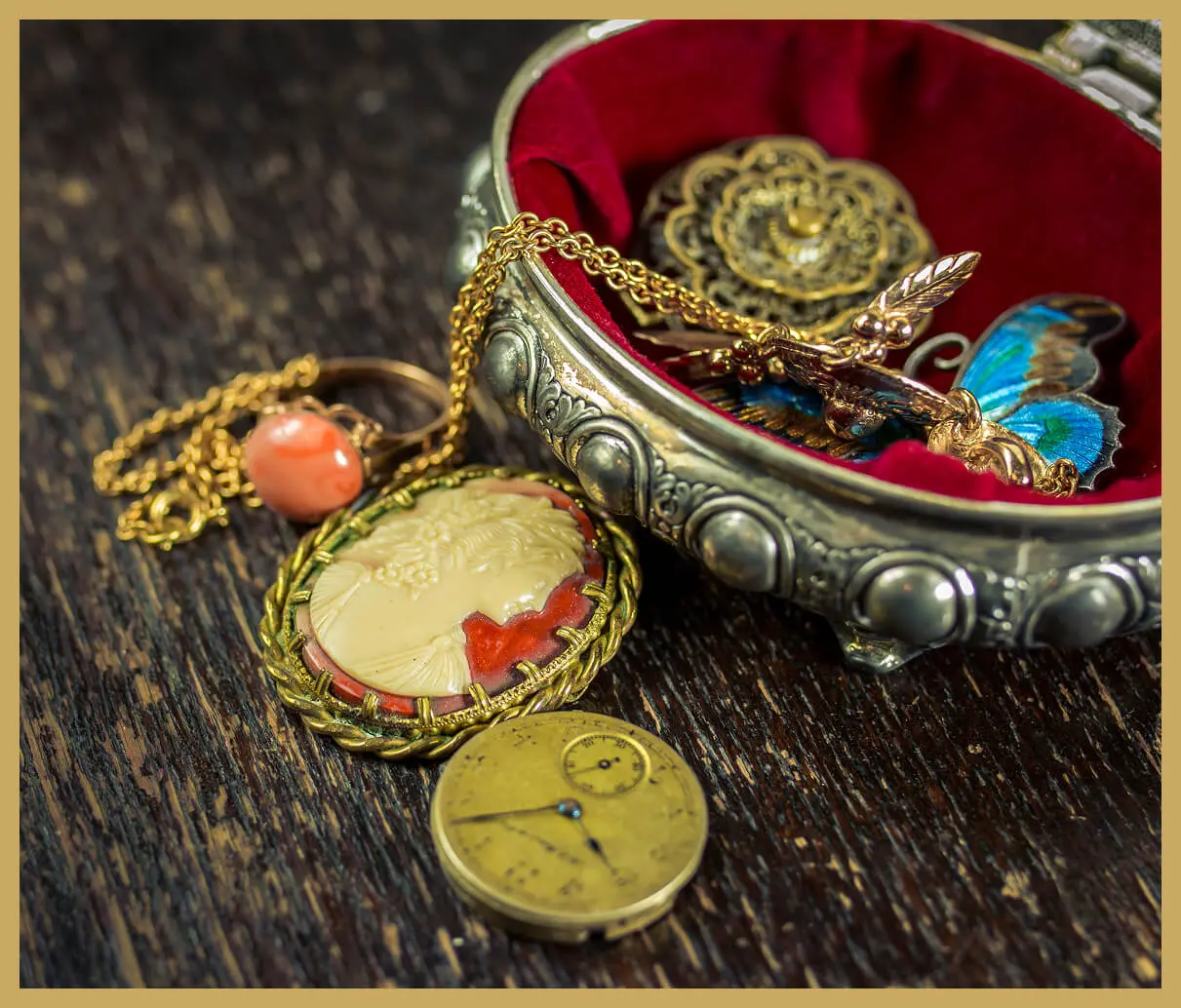 Vintage jewelry in ornate silver jewelry box.